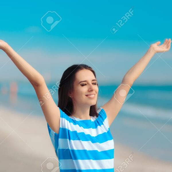 100921230-cheerful-happy-woman-reaching-her-arms-up-at-the-beach